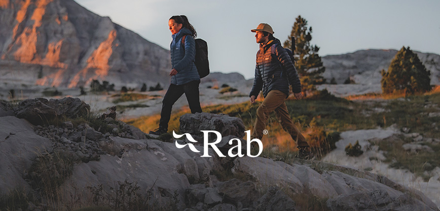 Woman and a man wearing a warm rab down jacket in the mountains